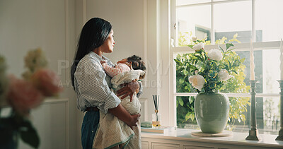Buy stock photo Mom, window and relax with baby girl in living room with hug, bonding and connection with love. People, mother and child for rest, reflection or relationship for security or support in family home