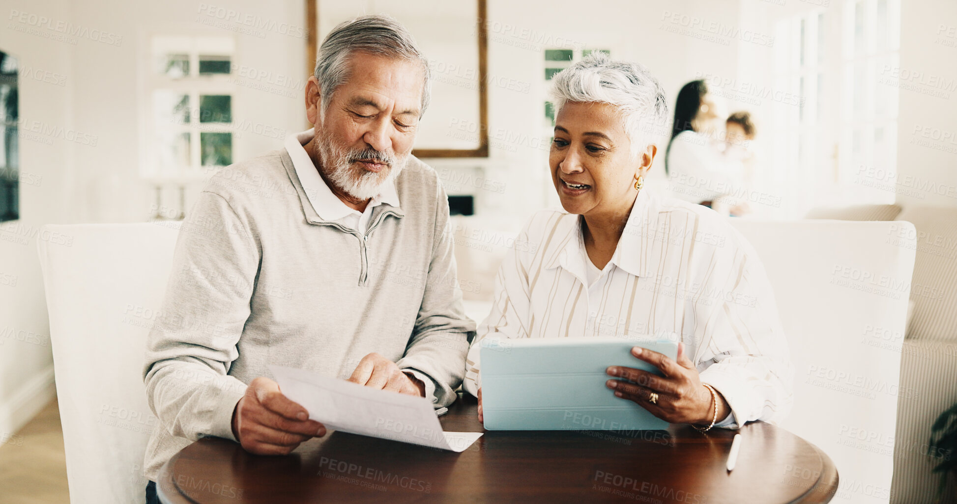Buy stock photo Old couple, reading and financial planning with tablet in house, happy or checking savings on report. Senior people, smile and discussion with technology, bonding and budget with statement in home