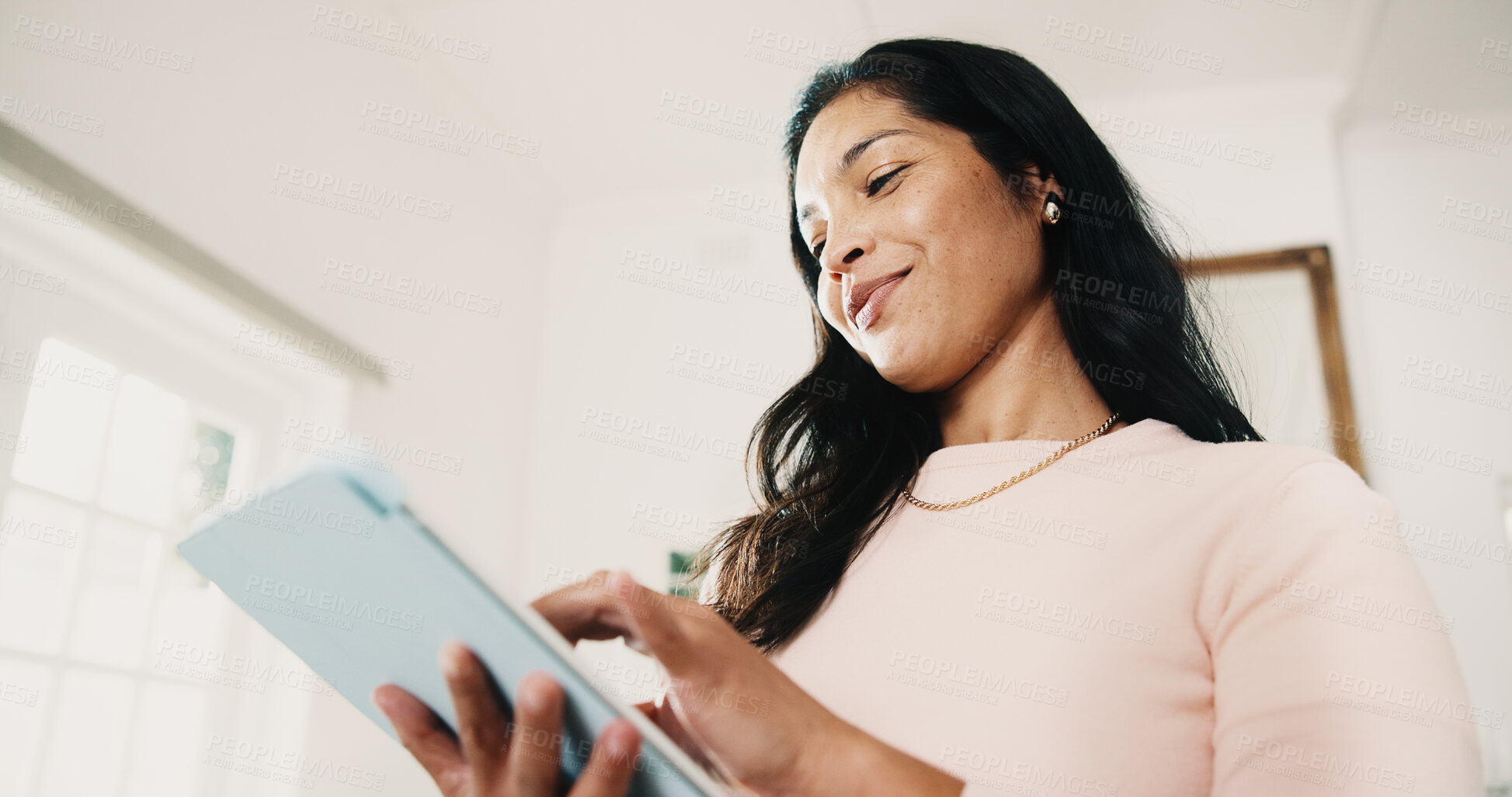 Buy stock photo Tablet, remote work and woman in home with research, story editing or happy with manuscript draft. Tech, freelancer and person reading review, creative chapter and author publication with low angle