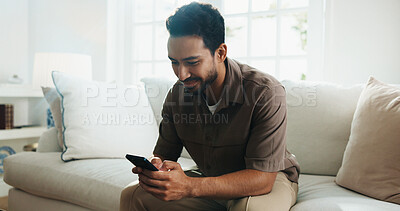 Buy stock photo Texting, smile or man on couch with phone, online communication or social media scroll on day off. Digital, happy and person in house with tech, message notification and chatting on weekend break.