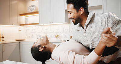 Buy stock photo Dancing, happy and couple in kitchen at house listening to music, playlist or radio together. Smile, love and man with woman for moving to song for bonding, care and connection in home on weekend.