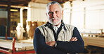 Portrait, man and carpenter in warehouse with arms crossed, timber manufacturing or craftsman skills. Serious, mature person and operations manager in workshop with confidence, woodwork or carpentry.