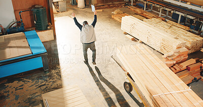 Buy stock photo Above, man and dancing in workshop for carpentry, good news and celebration of project success. Person, carpenter and groove in factory with clipboard, production target and for furniture achievement