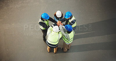 Buy stock photo Construction, team and hands together in meeting or above for unity, solidarity or mission. Top view, architect or group of contractors piling with stack in huddle for social cohesion or inclusion
