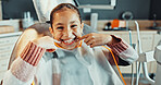 Portrait, child and happy in chair for dentistry, appointment and satisfaction of teeth whitening. Smile, girl and gesture at dental clinic for checkup, cleaning mouth and treatment for oral hygiene