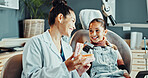 Dentist, woman and tooth model with girl, advice and appointment for checkup. Child healthcare, explanation and consulting with kid for dental care, oral hygiene and cleaning service in clinic