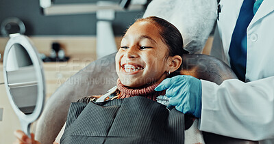 Buy stock photo Hands, dentist and child with mirror for dentistry, results and satisfaction of teeth whitening. Smile, person and kid patient at dental clinic for checkup, clean mouth and treatment for oral hygiene