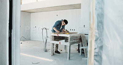 Buy stock photo Man, carpenter and sanding for construction with wood, restoration and furnishing for expansion. Male person, sandpaper and timber at site for carpentry, smooth surface and woodworking for renovation