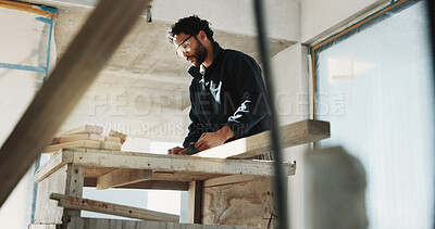 Buy stock photo Man, carpenter and sandpaper for construction with wood, restoration and furnishing for expansion. Male person, sanding and timber at site for carpentry, smooth surface and woodworking for renovation
