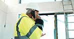 Construction, review or man on site with phone call, coordination or progress track in chat. PPE, contact or mature engineer with tech, operation feedback or supervisor briefing in communication.