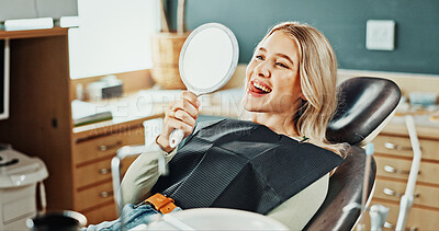 Buy stock photo Woman, smile and dental care with mirror for teeth whitening, results and oral hygiene at dentist clinic. Happy, patient and healthcare at orthodontist for tooth cleaning, veneers and implants