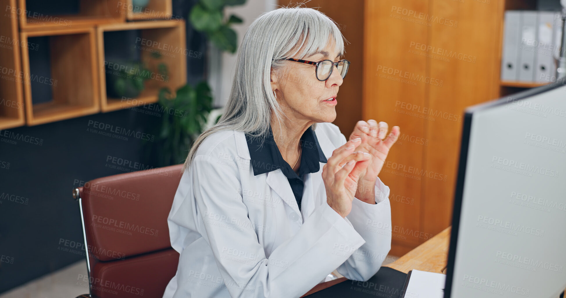 Buy stock photo Doctor, telehealth and woman with computer, video call and healthcare services on website in office. Health, advice and mature person with tech, online chat and communication with contact in hospital