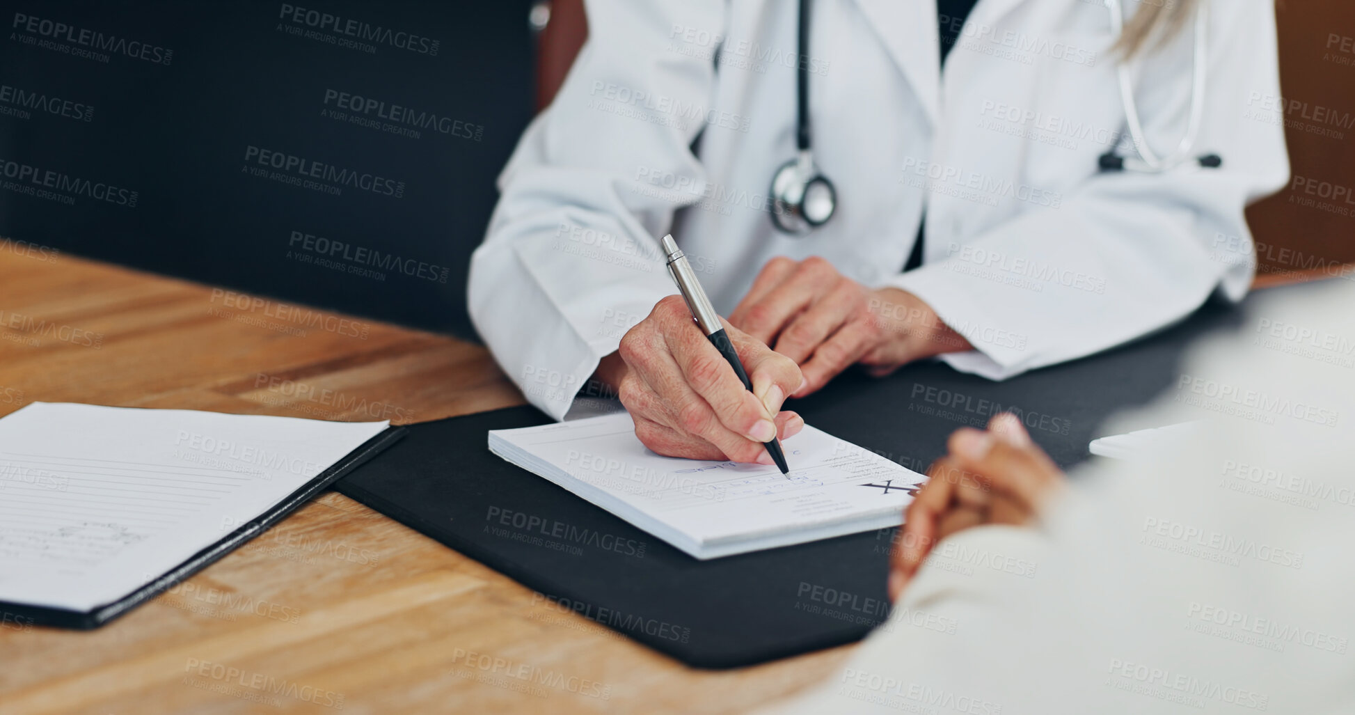 Buy stock photo Doctor, patient and hands writing with consultation for help, medicine prescription and sick letter. Healthcare worker, people and notes in clinic for medical certificate, referral or recommendation.