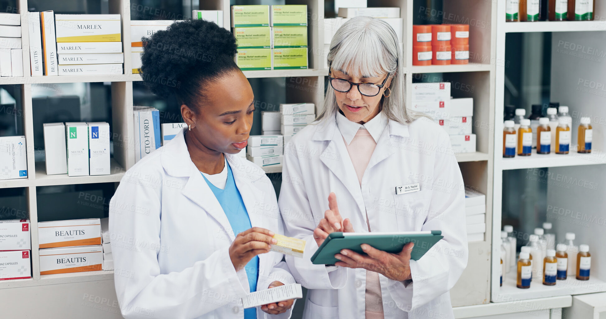 Buy stock photo Chemist, team and talk in pharmacy with tablet, check medicine and verify with prescription records. Pharmacist, people and review drugs in dispensary with tech, medical research and collaboration.