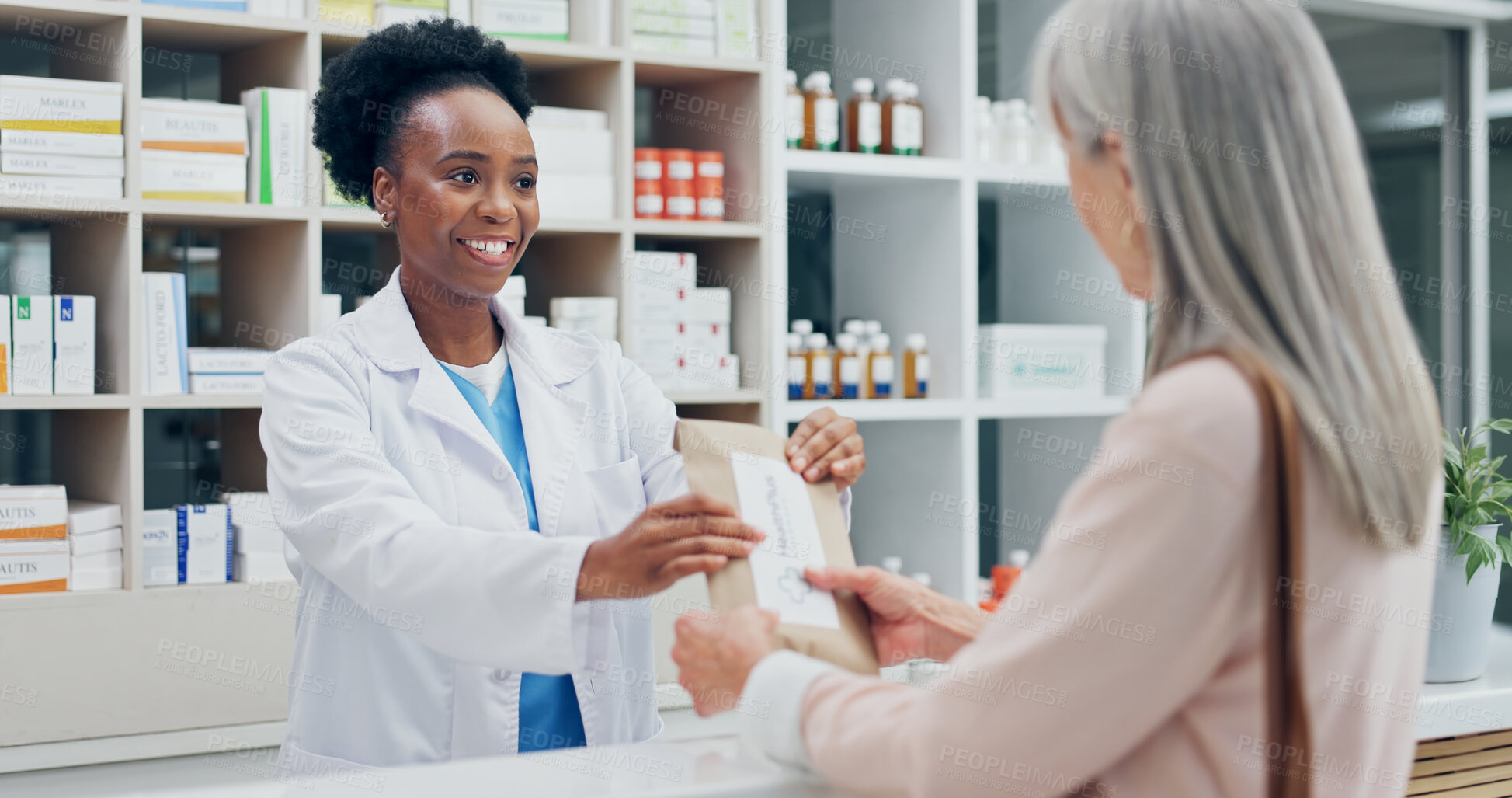 Buy stock photo Pharmacist, old woman and paper bag at pharmacy for medicine, dosage and pharmaceutical remedy. Employee, consulting and senior person at clinic with drugs, prescription and treatment instructions