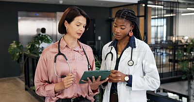 Buy stock photo Doctor, team and reading at hospital with tablet, research and blood test results for diagnosis. Women, review and collaboration at clinic with digital, mri scan report and medical records for health
