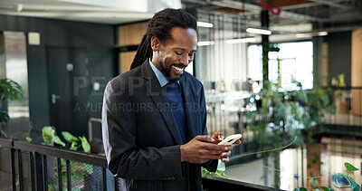 Buy stock photo Businessman, laughing and chatting with phone in office, communication or project update on website. Typing, online and black person with smile for message, happy and network with contact on mobile