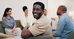 Wellness, man and happy in meeting for support group, self improvement or emotional wellbeing. Community center, member and portrait for social connection, healing circle and mutual aid in recovery