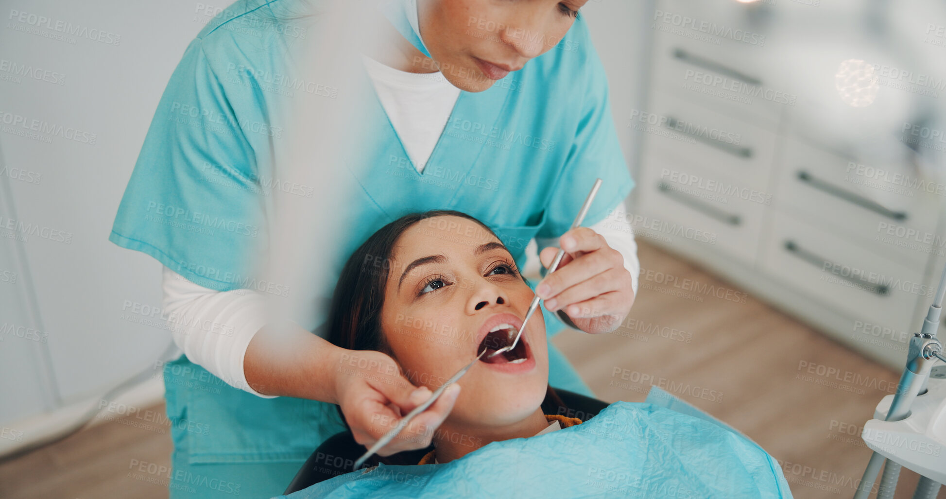 Buy stock photo Women, dentist and tools with patient for exam, oral care or treatment for healthcare in clinic. Hygiene, orthodontics and people with dentistry consultation for root canal, dental surgery or checkup