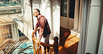 Smile, man and balcony at hotel for holiday, adventure and guest check in at luxury accommodation. Above, mature person and terrace at retreat with scenic view, travel experience and weekend getaway