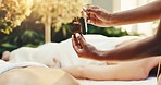 Hands, woman and oil at spa for massage, deep tissue and holistic treatment for stress relief. Masseuse, people and aromatherapy at salon for self care, muscle stiffness and therapeutic for wellness