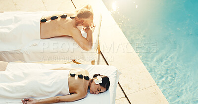 Buy stock photo Spa, above and couple with hot stones for massage, stress relief and holistic treatment on holiday. Marriage, hotel and man with woman with heat therapy for pamper, wellness and relax for anniversary