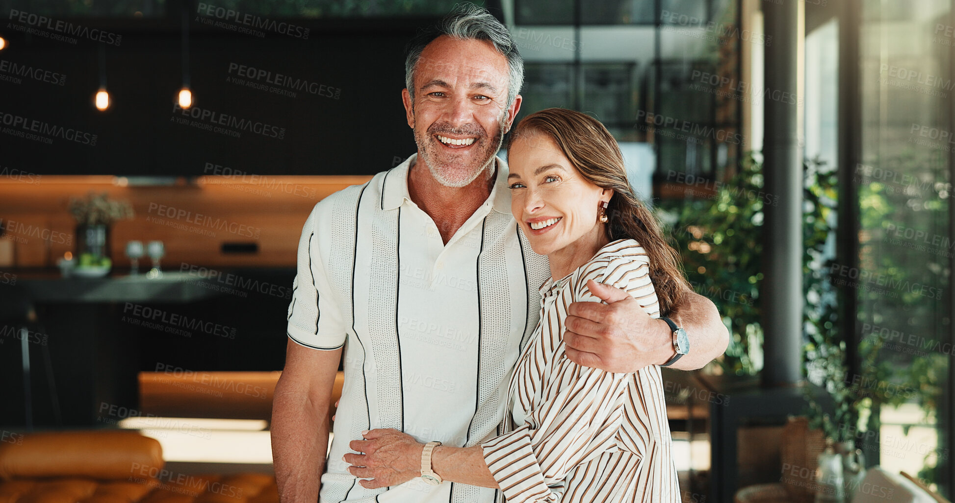 Buy stock photo Portrait, hug and mature couple in home with smile, companion and bonding together on weekend break. Happy, people and embrace in house with romantic relationship, wellness and support for partner.