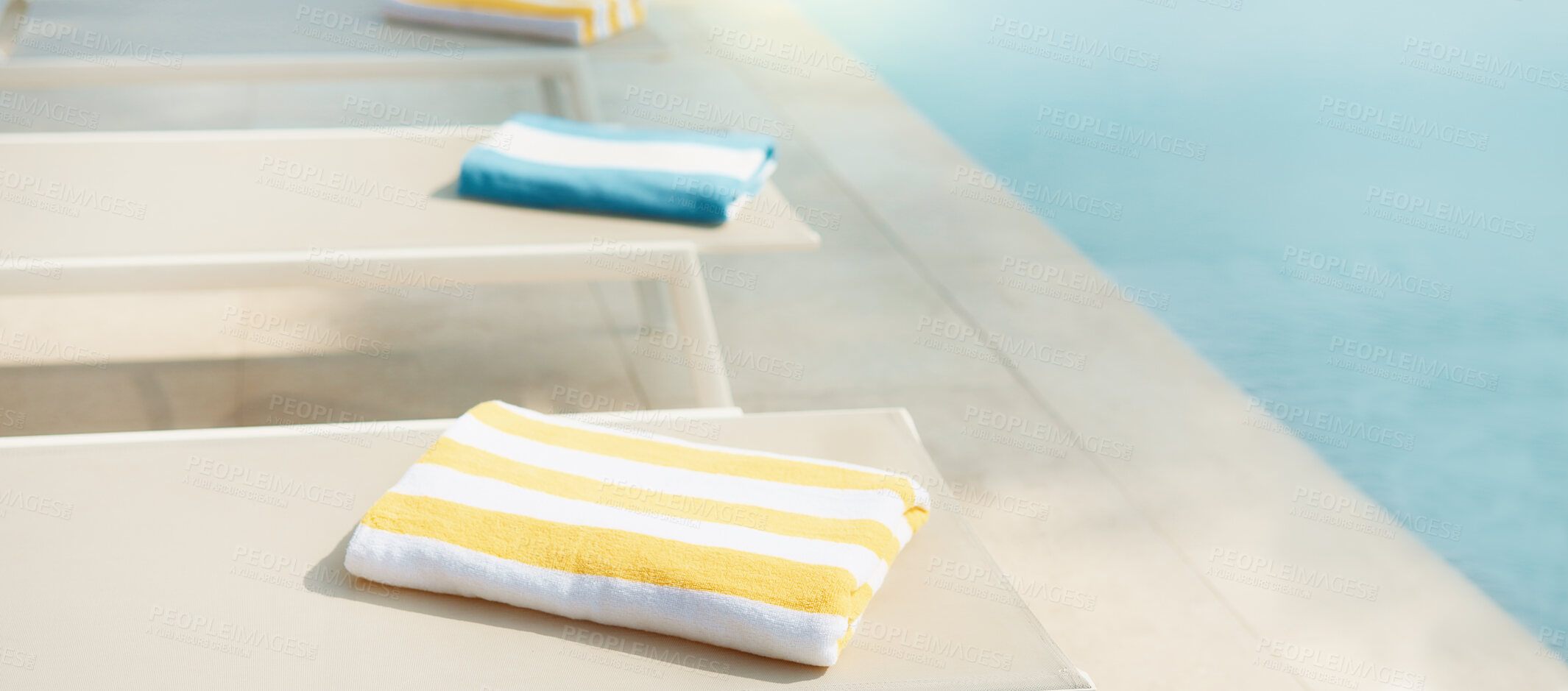 Buy stock photo Empty, chair and towel at resort with swimming pool, guest comfort and reserved seating on holiday. Fabric, poolside and sun lounger at retreat with amenity, sunbathing and hospitality on vacation