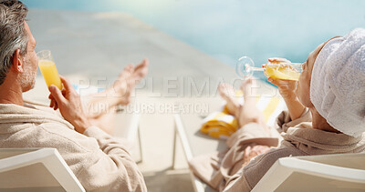 Buy stock photo Drinks, couple and relax at swimming pool on vacation, summer break and bonding together on getaway. Poolside, mature man and woman with mimosa cocktail, holiday and back at luxury resort with love