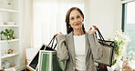 Smile, woman and shopping bag in home for fashion, clothing haul and purchase for retail spree. Portrait, mature person and package at house with new outfit, bargain and discount for wardrobe restock