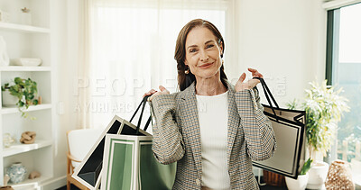 Buy stock photo Smile, woman and shopping bag in home for fashion, clothing haul and purchase for retail spree. Portrait, mature person and package at house with new outfit, bargain and discount for wardrobe restock