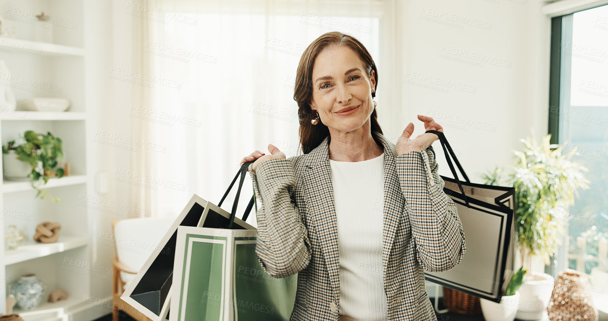 Buy stock photo Smile, woman and shopping bag in home for fashion, clothing haul and purchase for retail spree. Portrait, mature person and package at house with new outfit, bargain and discount for wardrobe restock
