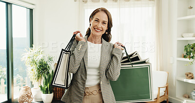 Buy stock photo Woman, shopping and bag in home for fashion, clothing haul and purchase for retail therapy. Portrait, mature person and package in lounge with new outfit, collection and discount for wardrobe restock