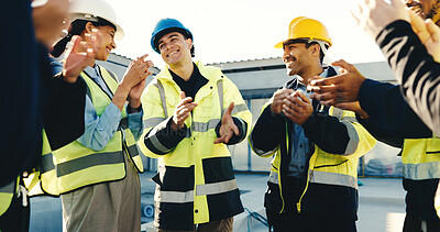 Buy stock photo Happy, technician and team at construction site with applause, property development success or goals. People, electrician or engineer clapping outdoor with celebration, building approval or good news
