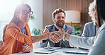 Happy, meeting and business people with handshake in office for hiring, onboarding or agreement. Excited, group or employees shaking hands with smile for recruitment process, success or opportunity
