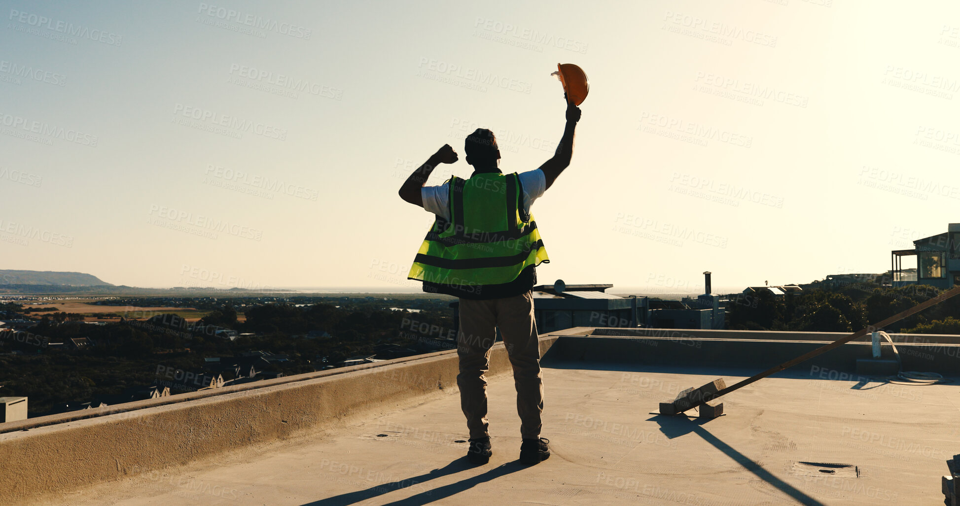 Buy stock photo Back, engineer and fist pump outdoor for construction, good news and foundation success of project. Space, man or raised hands on rooftop for celebration, pass inspection and architecture achievement