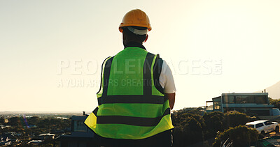 Buy stock photo Builder, man and thinking at construction site with city view, brainstorming or planning for project. Back, worker and person outdoor in urban space with building evaluation, infrastructure or vision