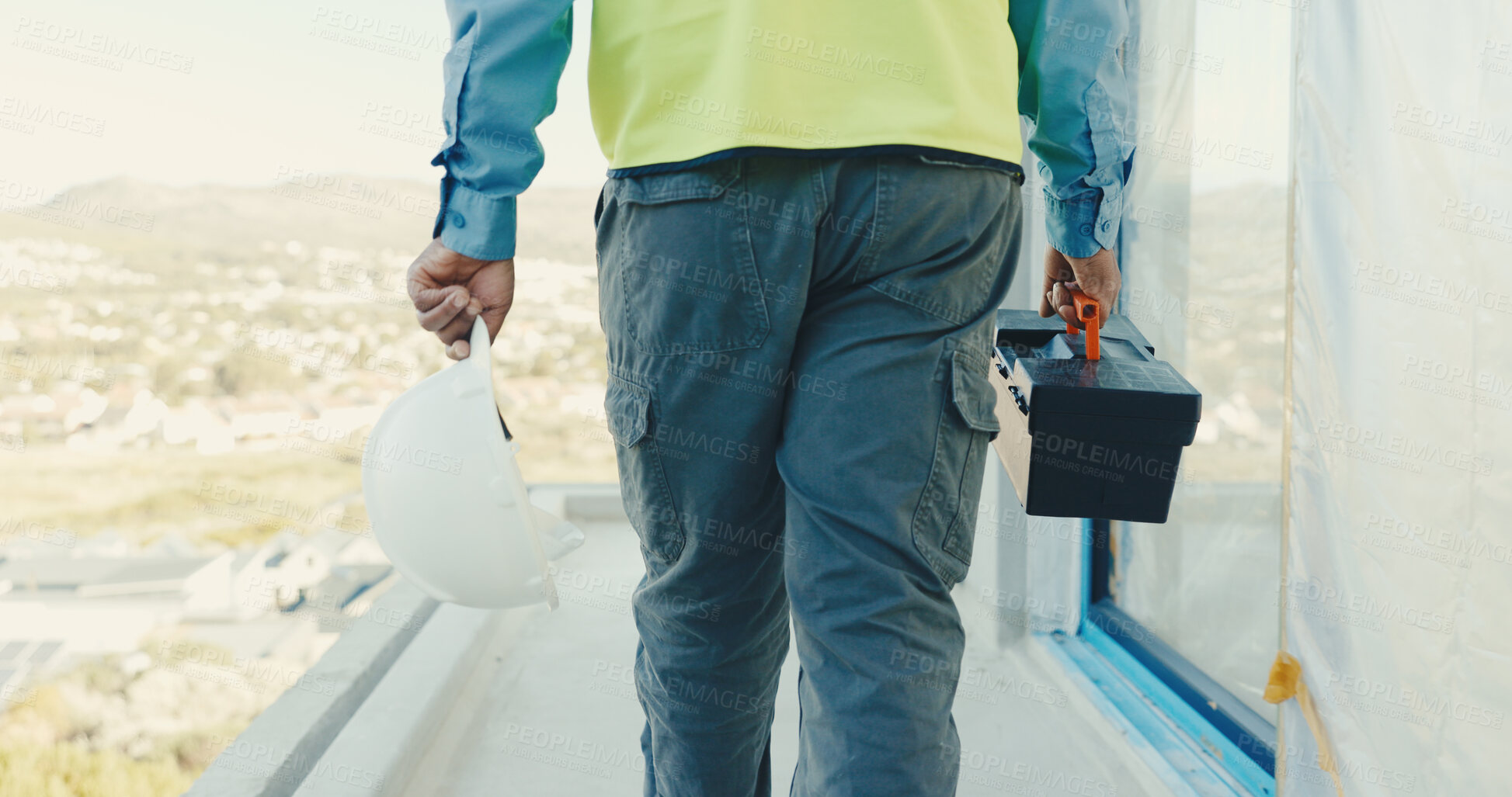 Buy stock photo Architect, hands and helmet with toolbox on construction site for building equipment or preparation. Back view, person or civil engineer with hard hat or gear for architecture, fix or repair service
