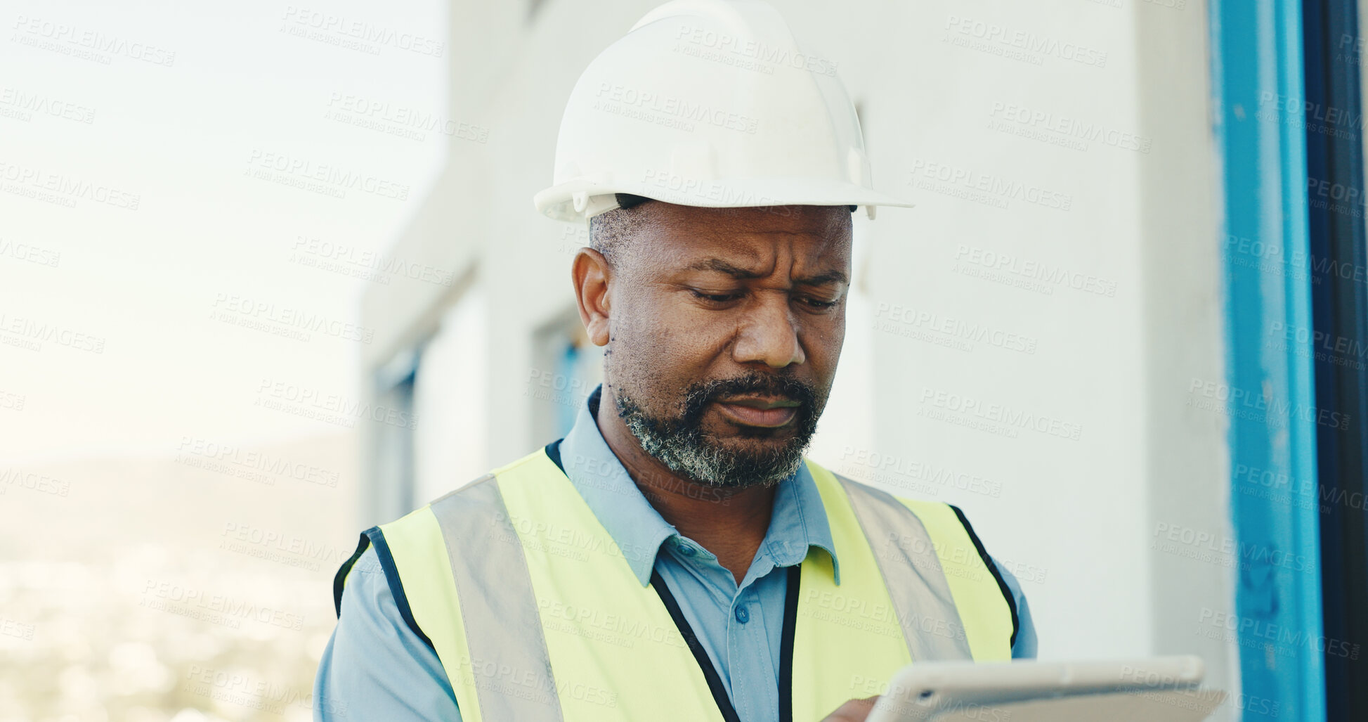 Buy stock photo Concern, black man and tablet on construction site for inspection, safety regulations or building. Mature person, architect and worried with tech for infrastructure, renovation issue or security