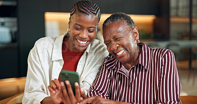 Buy stock photo Senior mother, laughing and woman with phone in home, entertainment or watching video with daughter. Family, online and bonding with elderly parent, happy and black people with mobile for funny film