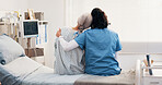 Healthcare, hug and nurse with old woman on hospital bed for bonding, rehabilitation or support. Back, love and medical professional embracing senior patient in clinic for recovery or wellness