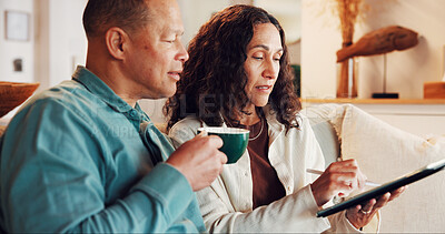 Buy stock photo Tablet, coffee break and couple in living room on sofa, streaming video or bonding. Digital tech, relax and mature man with woman and networking for social media research or internet browsing in home