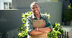 Senior, happy woman and arms crossed in backyard for gardening, plant care or retirement hobby. Pensioner, black person or confident portrait for garden maintenance, healthy aging or gardener at home