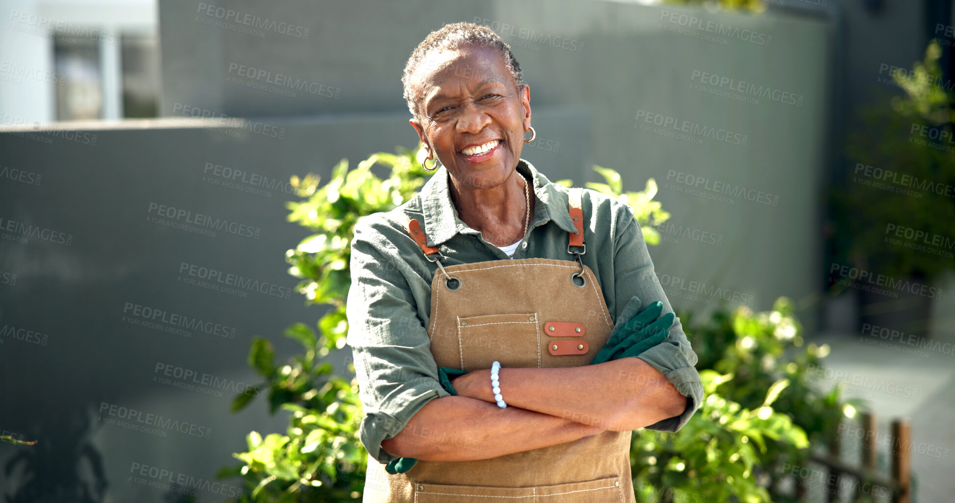 Buy stock photo Senior, happy woman and arms crossed in backyard for gardening, plant care or retirement hobby. Pensioner, black person or confident portrait for garden maintenance, healthy aging or gardener at home