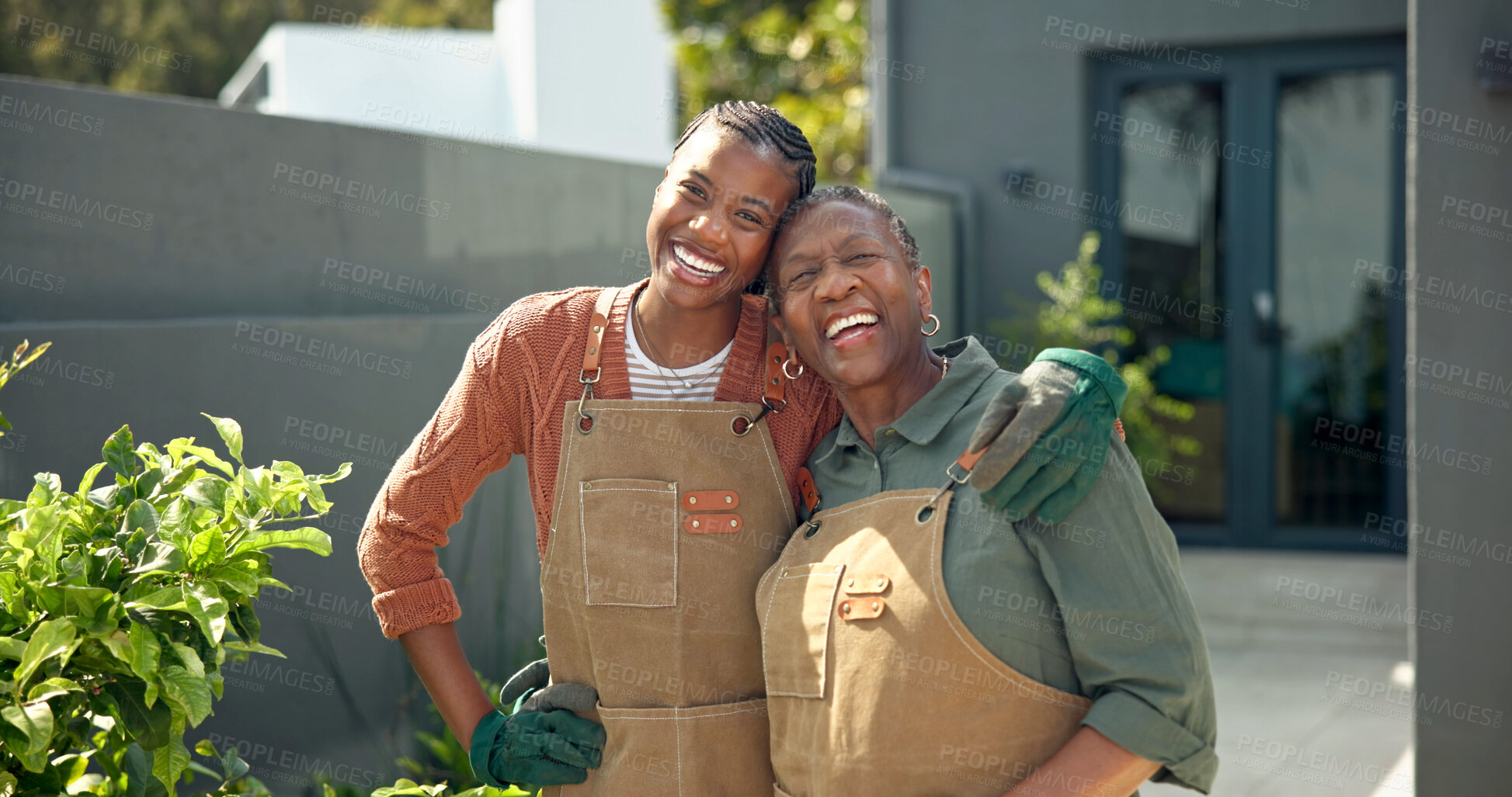Buy stock photo Senior, mother and happy woman in backyard for gardening, eco friendly hobby and bonding at home. Black family, pensioner and adult daughter with hug, plant care and garden maintenance with portrait