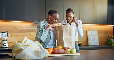 Buy stock photo Family, unpacking and women with grocery in kitchen, together or bonding with senior mother in home. Black people, happiness and elderly parent with shopping bag, fruit and healthy food in house