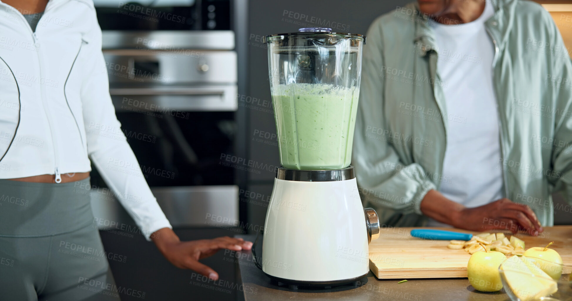 Buy stock photo People, fruit and blender at house for smoothie, healthy drink and fresh produce for nutrition. Hands, family and machine in kitchen with ingredients, detox beverage and protein shake for gut health