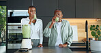 Black family, drinking and glass at house with smoothie, healthy drink and green juice for diet. Old woman, daughter and blender in kitchen with protein shake, organic ingredients and detox beverage