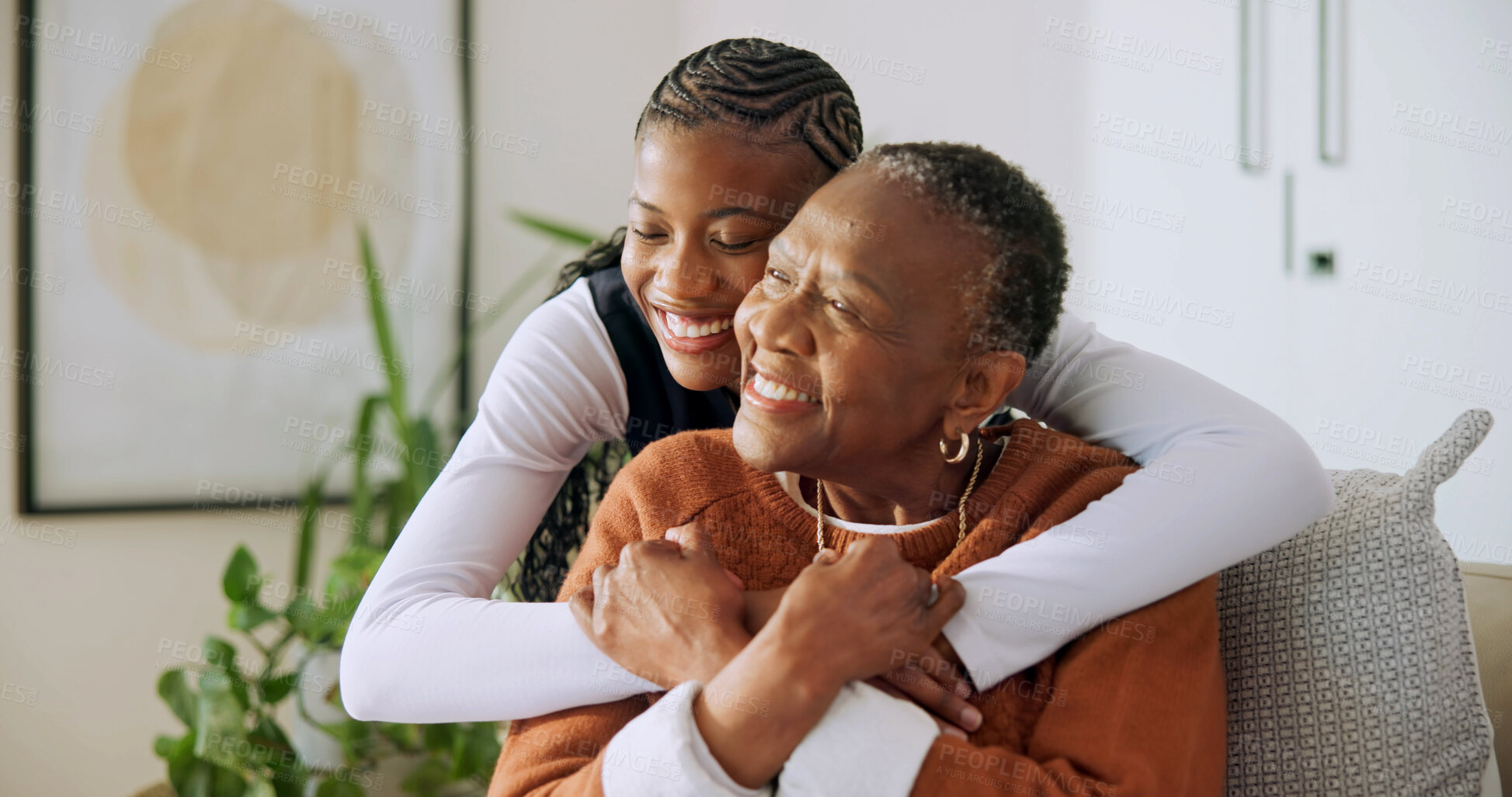 Buy stock photo Old woman, support and holding hands with daughter in home, laughing and bonding together in lounge. Family, connection and hug with senior black person, love and happy with mother in living room