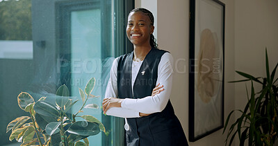 Buy stock photo Happy, window and caregiver with crossed arms in nursing home for support, career and healthcare. Portrait, nurse and black woman with pride for medical service, job and trust at retirement facility